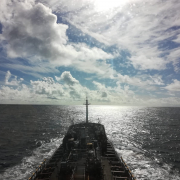 Ship at sea with cloudy sky