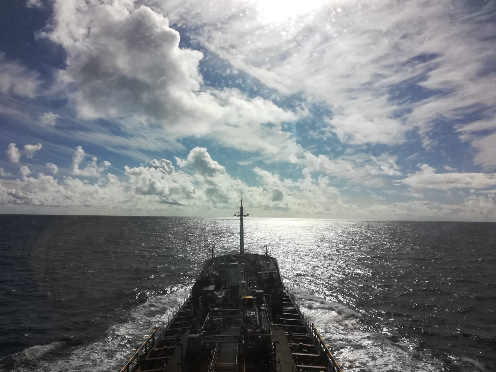 Ship at sea with cloudy sky